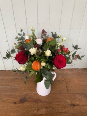 Festive jug of blooms